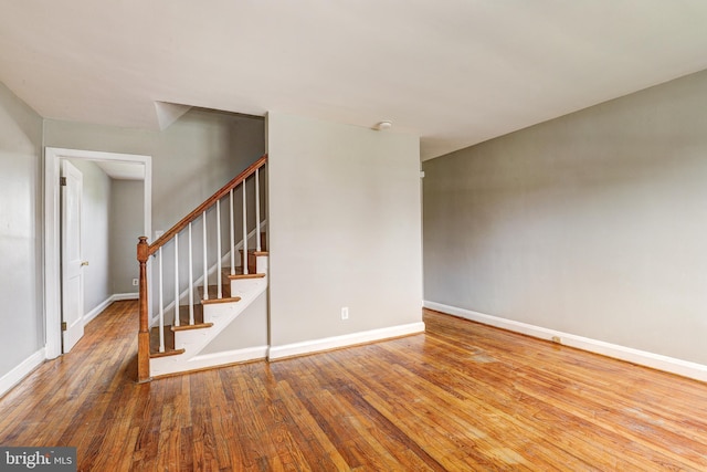 1334 Dalton Rd, Baltimore, MD 21234 - empty room featuring hardwood / wood-style flooring, baseboards, and stairway