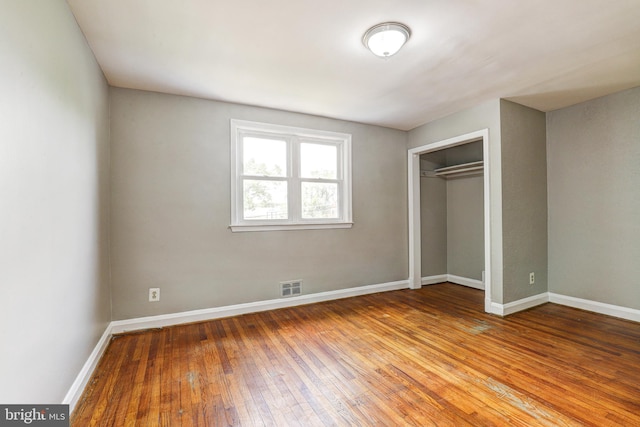 1334 Dalton Rd, Baltimore, MD 21234 - unfurnished bedroom featuring wood-type flooring, baseboards, and a closet