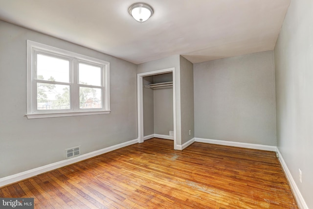 1334 Dalton Rd, Baltimore, MD 21234 - unfurnished bedroom featuring light wood-style flooring, baseboards, and a closet