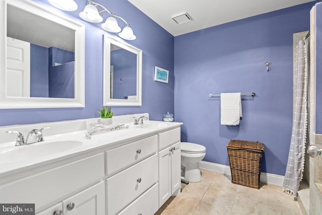 603 Admiral Dr Unit 204, Annapolis, MD 21401 - full bathroom featuring toilet, double vanity, tile patterned flooring, and a shower with shower curtain