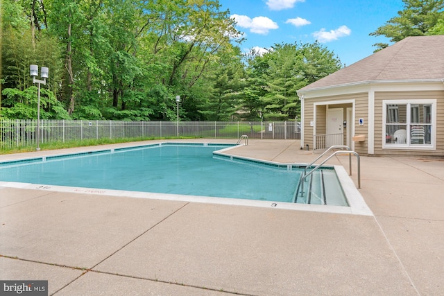 603 Admiral Dr Unit 204, Annapolis, MD 21401 - community pool with fence, a patio area, and view of wooded area