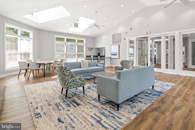 603 Admiral Dr Unit 204, Annapolis, MD 21401 - living area featuring ceiling fan, a skylight, wood finished floors, high vaulted ceiling, and recessed lighting