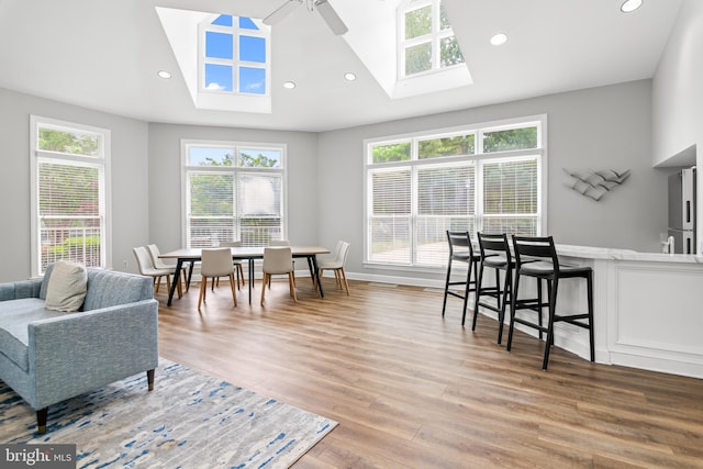 603 Admiral Dr Unit 204, Annapolis, MD 21401 - living room with a skylight, lofted ceiling, light wood-style flooring, recessed lighting, and ceiling fan