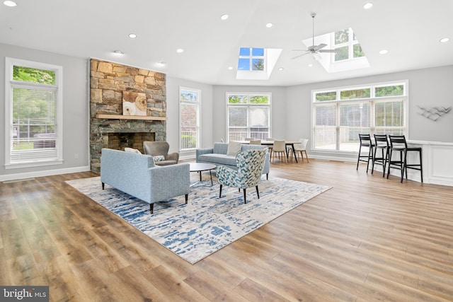 603 Admiral Dr Unit 204, Annapolis, MD 21401 - living area with a skylight, light wood-type flooring, a fireplace, and recessed lighting