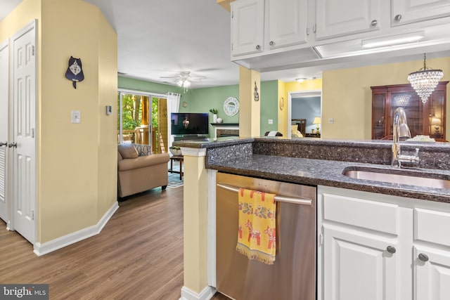603 Admiral Dr Unit 204, Annapolis, MD 21401 - kitchen featuring stainless steel dishwasher, a sink, wood finished floors, ceiling fan, and white cabinetry