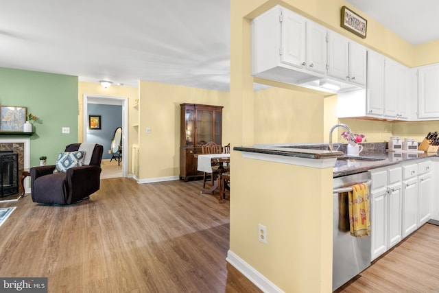 603 Admiral Dr Unit 204, Annapolis, MD 21401 - kitchen with dishwasher, light wood-style flooring, a sink, and white cabinets