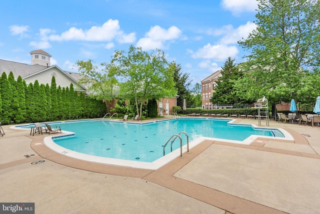 42432 Hollyhock Ter Unit 101, Brambleton, VA 20148 - community pool with a patio area