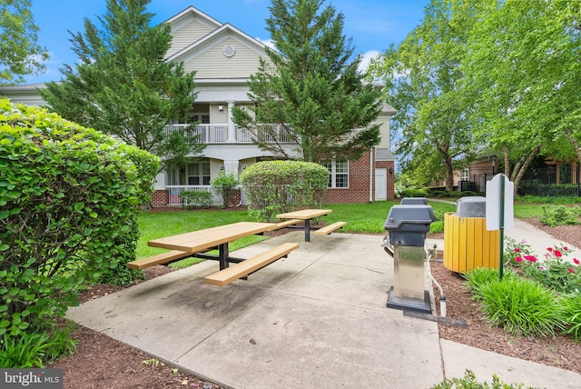 42432 Hollyhock Ter Unit 101, Brambleton, VA 20148 - view of property's community with a yard and a patio