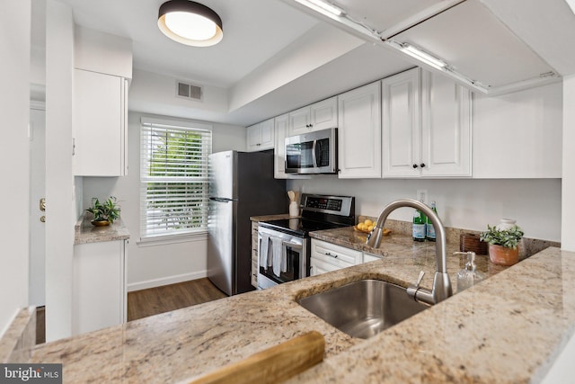 3316 Lakeside View Dr Unit 3-7, Falls Church, VA 22041 - kitchen with stainless steel appliances, a sink, light stone countertops, and white cabinetry