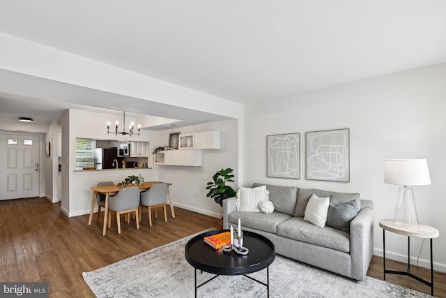 3316 Lakeside View Dr Unit 3-7, Falls Church, VA 22041 - living room featuring a chandelier, baseboards, and wood finished floors