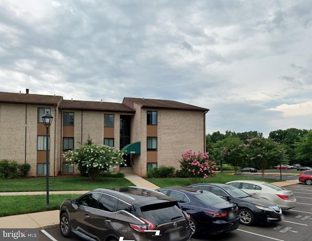6916 Hanover Pkwy Unit 300, Greenbelt, MD 20770 - view of building exterior with uncovered parking