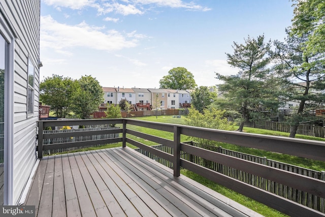 wooden deck featuring a residential view