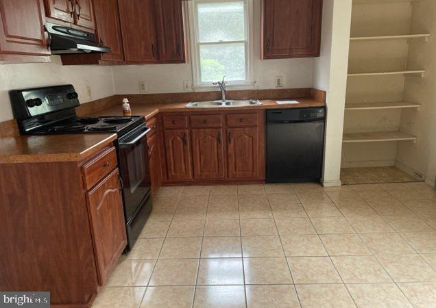 3365 Arundel On The Bay Rd, Annapolis, MD 21403 - kitchen featuring black appliances, under cabinet range hood, a sink, light tile patterned floors, and brown cabinets