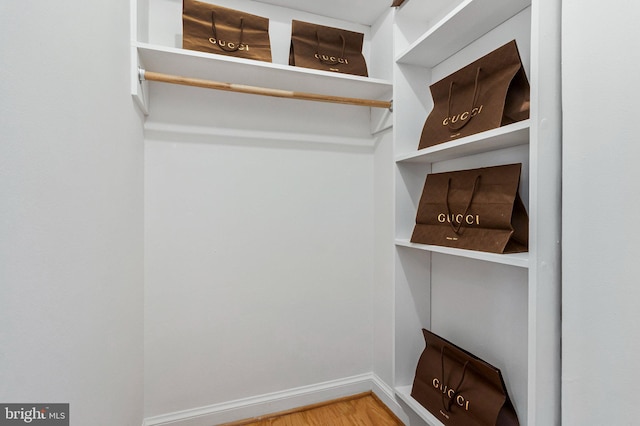spacious closet with wood finished floors