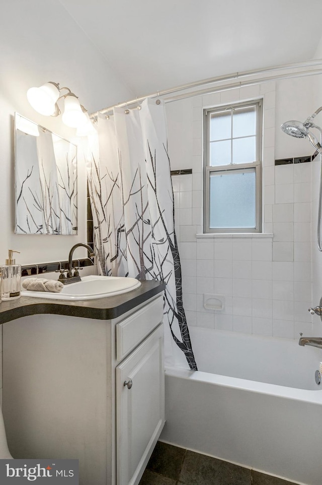 bathroom with shower / tub combo, vanity, and tile patterned flooring