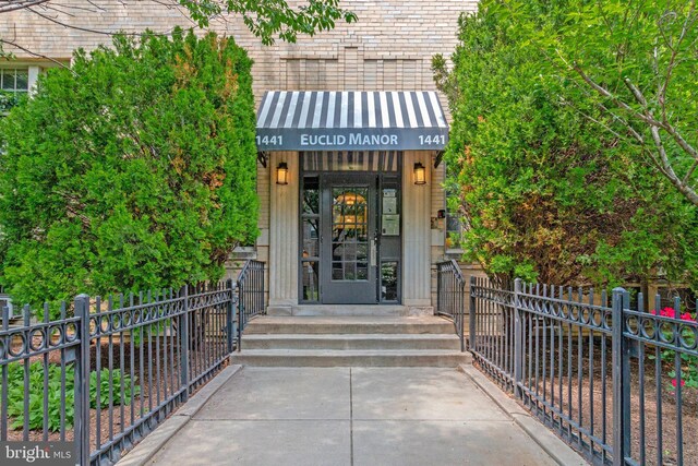 property entrance with fence