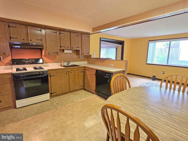 kitchen featuring range with gas stovetop, dishwasher, a sink, under cabinet range hood, and light countertops