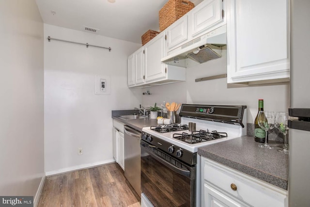 2829 Connecticut Ave NW Unit 312, Washington, DC 20008 - kitchen featuring gas range, under cabinet range hood, a sink, stainless steel dishwasher, and white cabinets
