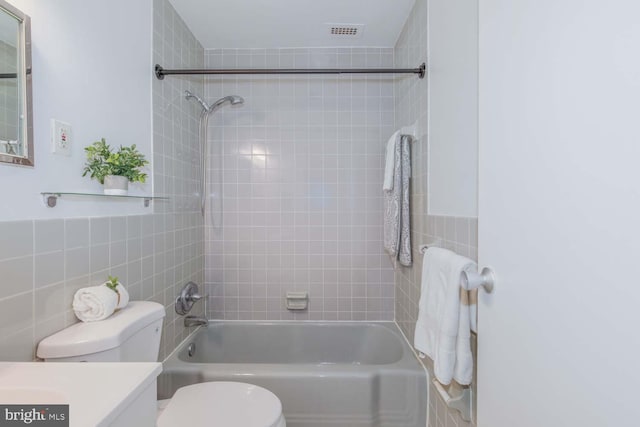 2829 Connecticut Ave NW Unit 312, Washington, DC 20008 - bathroom with tile walls, toilet, vanity, and shower / bathtub combination