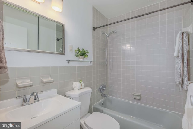 2829 Connecticut Ave NW Unit 312, Washington, DC 20008 - bathroom featuring tile walls, shower / tub combination, toilet, and vanity