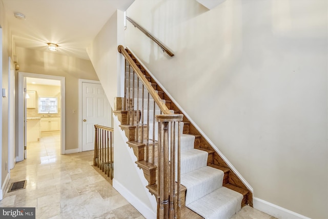 stairway with baseboards