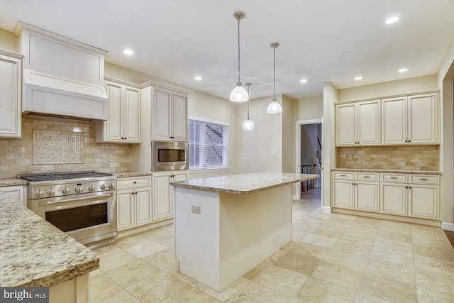 kitchen featuring appliances with stainless steel finishes, decorative backsplash, light stone countertops, pendant lighting, and recessed lighting