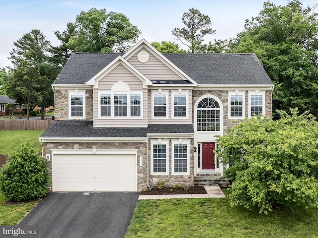 800 Kennedy Dr, Winchester, VA 22601 - view of front facade with stone siding, a garage, and roof with shingles