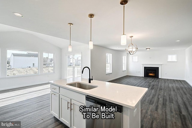 kitchen with a sink, dishwasher, dark wood finished floors, white cabinets, and recessed lighting