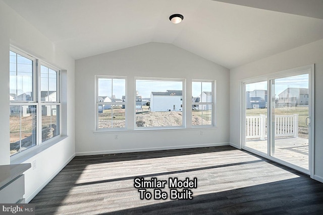 unfurnished sunroom with healthy amount of natural light and vaulted ceiling