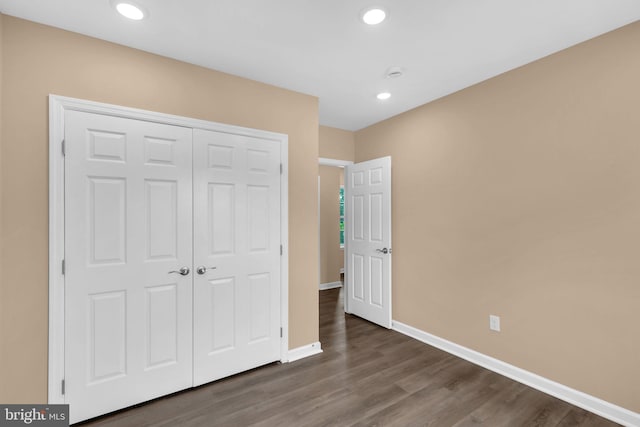 4820 Hayes St NE, Washington, DC 20019 - unfurnished bedroom featuring baseboards, a closet, dark wood finished floors, and recessed lighting