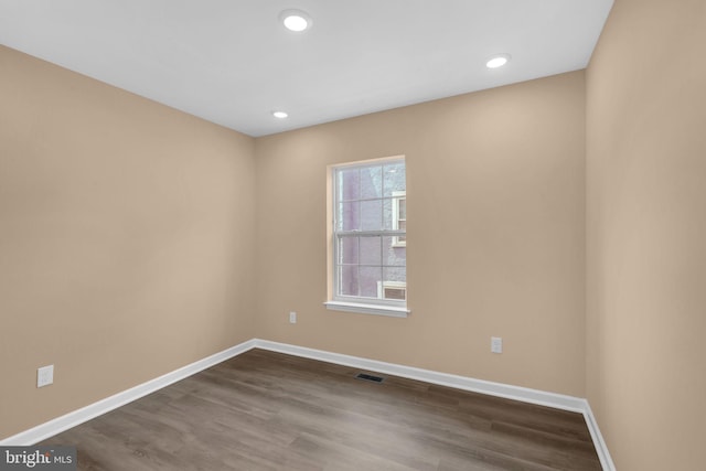4820 Hayes St NE, Washington, DC 20019 - unfurnished room featuring baseboards, dark wood-style floors, and recessed lighting