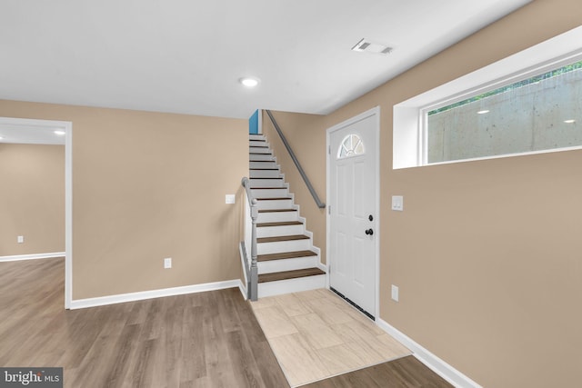 4820 Hayes St NE, Washington, DC 20019 - entryway featuring wood finished floors, stairway, baseboards, and recessed lighting