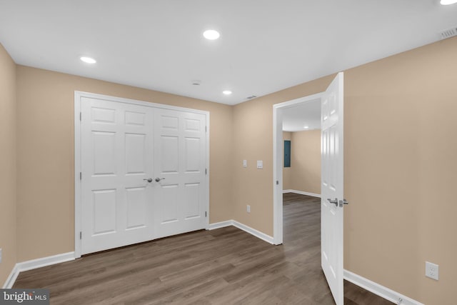 4820 Hayes St NE, Washington, DC 20019 - unfurnished bedroom with wood finished floors, baseboards, recessed lighting, and a closet