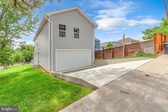 4820 Hayes St NE, Washington, DC 20019 - view of property exterior featuring a garage and concrete driveway