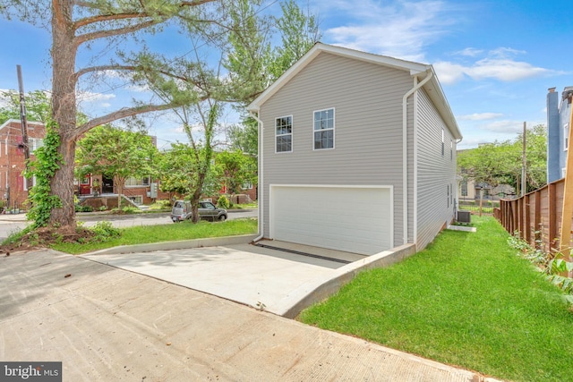 4820 Hayes St NE, Washington, DC 20019 - view of home's exterior with an attached garage, cooling unit, and driveway