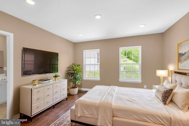 4820 Hayes St NE, Washington, DC 20019 - bedroom with dark wood-type flooring, baseboards, and recessed lighting