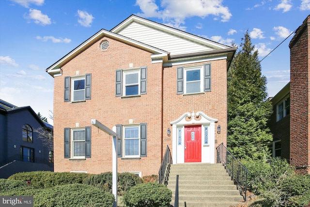 view of front of house with brick siding