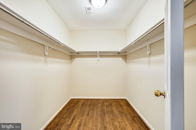 spacious closet featuring wood finished floors