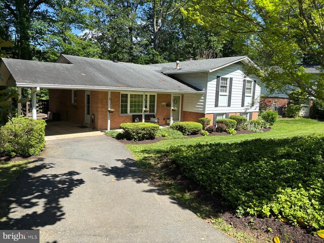 3402 Albion Ct, Fairfax, VA 22031 - split level home featuring asphalt driveway, brick siding, a carport, and roof with shingles