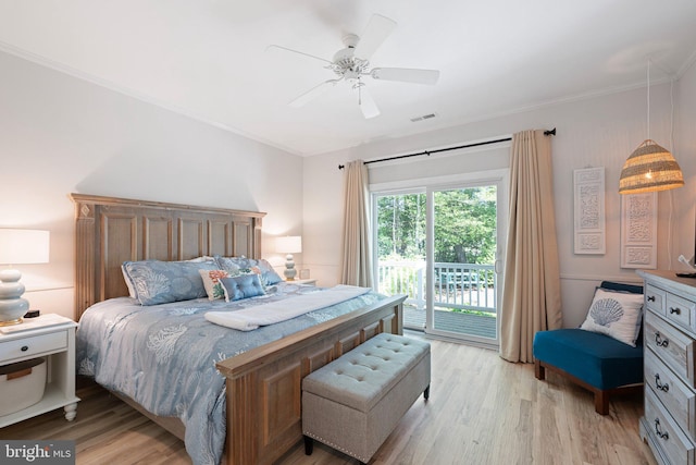bedroom featuring access to exterior, light wood-style floors, ornamental molding, and a ceiling fan