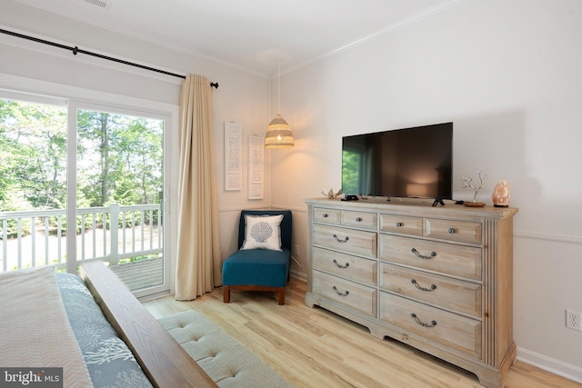 bedroom featuring access to outside, light wood finished floors, crown molding, and baseboards