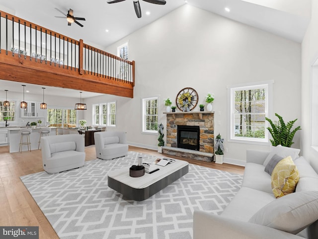 26 Susquehanna Dr, Jim Thorpe, PA 18229 - living area featuring high vaulted ceiling, light wood-type flooring, ceiling fan, recessed lighting, and a fireplace