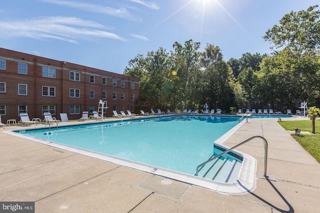 community pool with a patio area