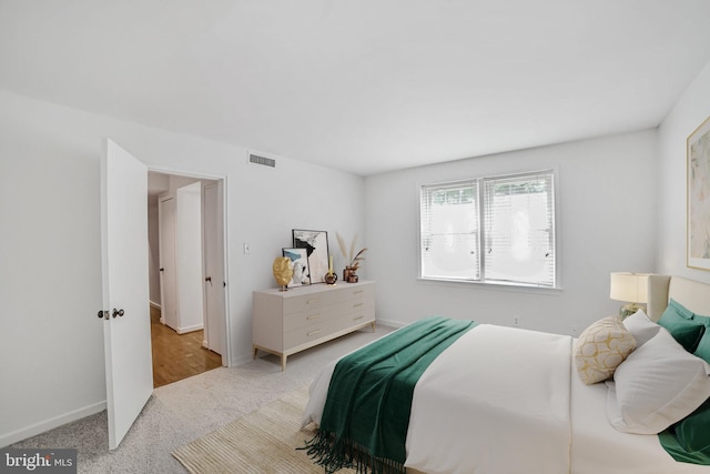bedroom with carpet floors and baseboards