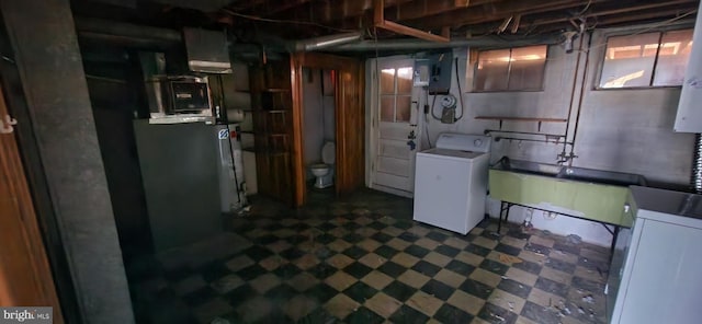 2247 Searles Rd, Baltimore, MD 21222 - basement featuring washer / clothes dryer and dark floors