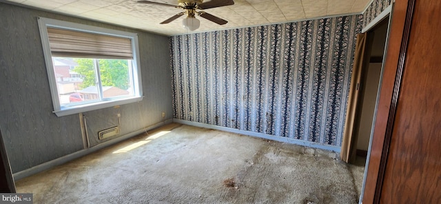 2247 Searles Rd, Baltimore, MD 21222 - empty room with carpet, a ceiling fan, wallpapered walls, and baseboards