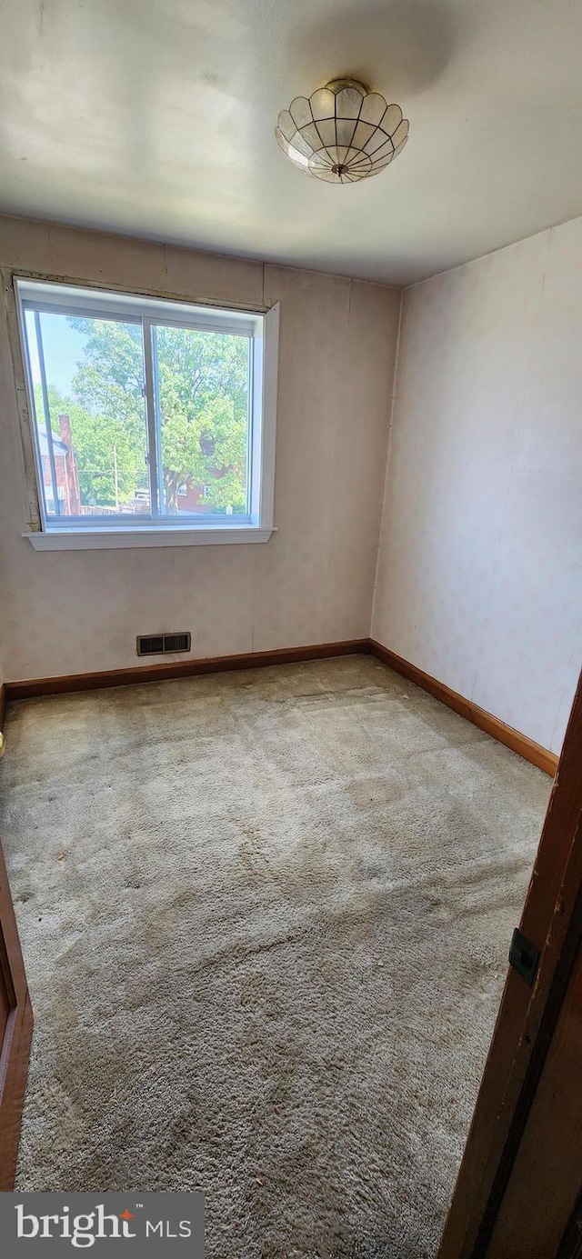 2247 Searles Rd, Baltimore, MD 21222 - empty room featuring carpet flooring, healthy amount of natural light, and baseboards