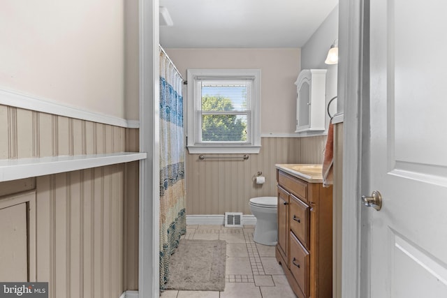 714 Meredith St, Kennett Square, PA 19348 - full bathroom with toilet, a wainscoted wall, vanity, and tile patterned flooring