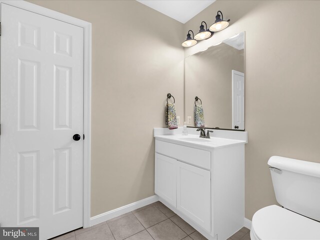 6510 Christmas Tree Ln, Huntingtown, MD 20639 - bathroom with toilet, baseboards, tile patterned floors, and vanity