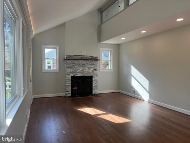 8107 Chester St, Takoma Park, MD 20912 - unfurnished living room with a fireplace, lofted ceiling, healthy amount of natural light, wood finished floors, and baseboards